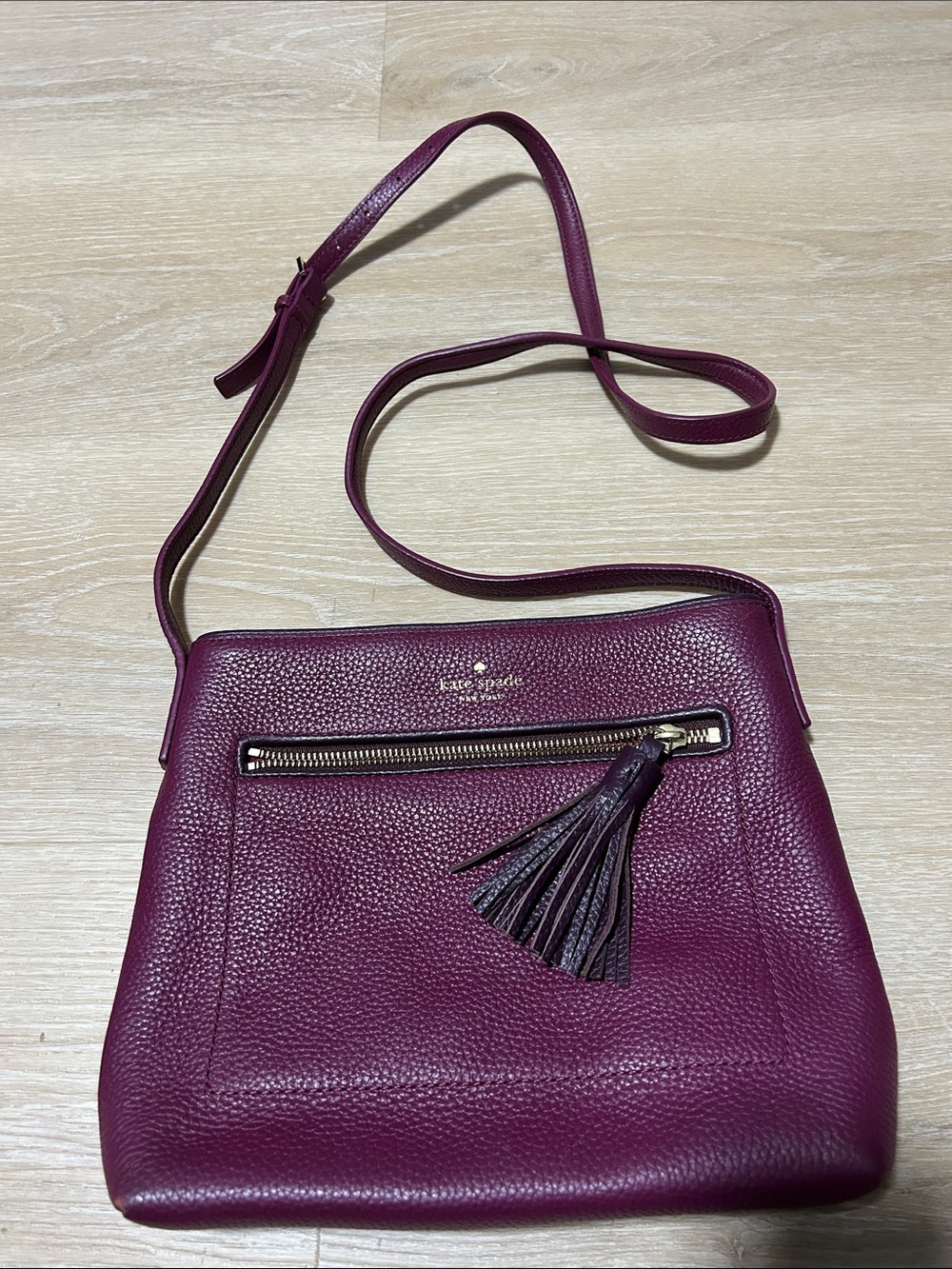 kate spade pebbled leather crossbody in plum with tassel accent